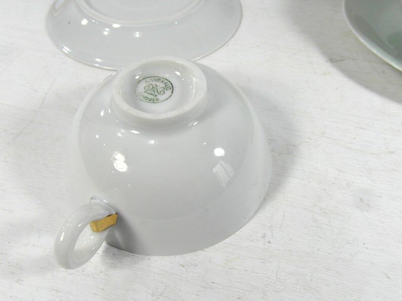 White porcelain and mint cups and saucers, half a cup