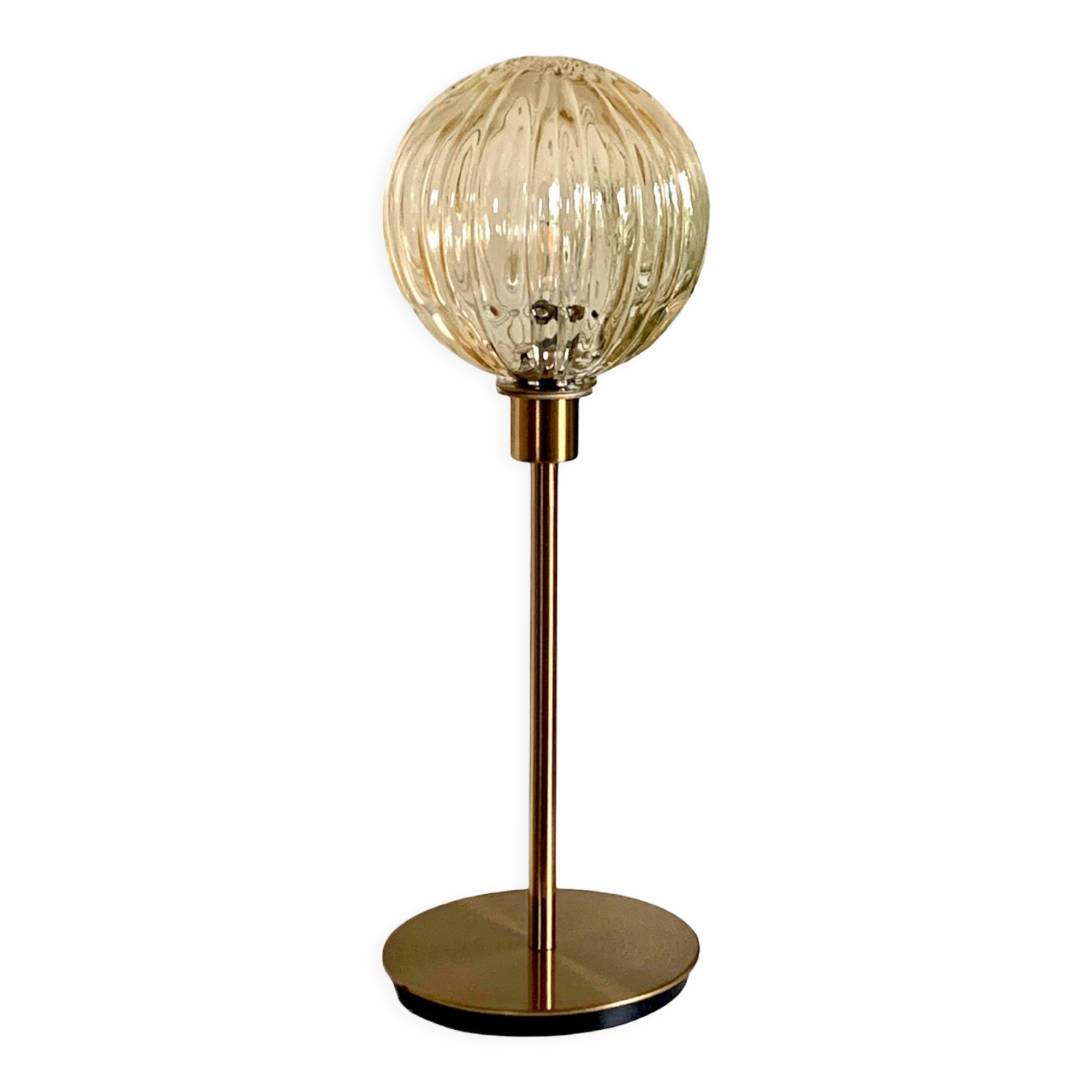 Table lamp with an antique golden streaked globe and a golden foot
