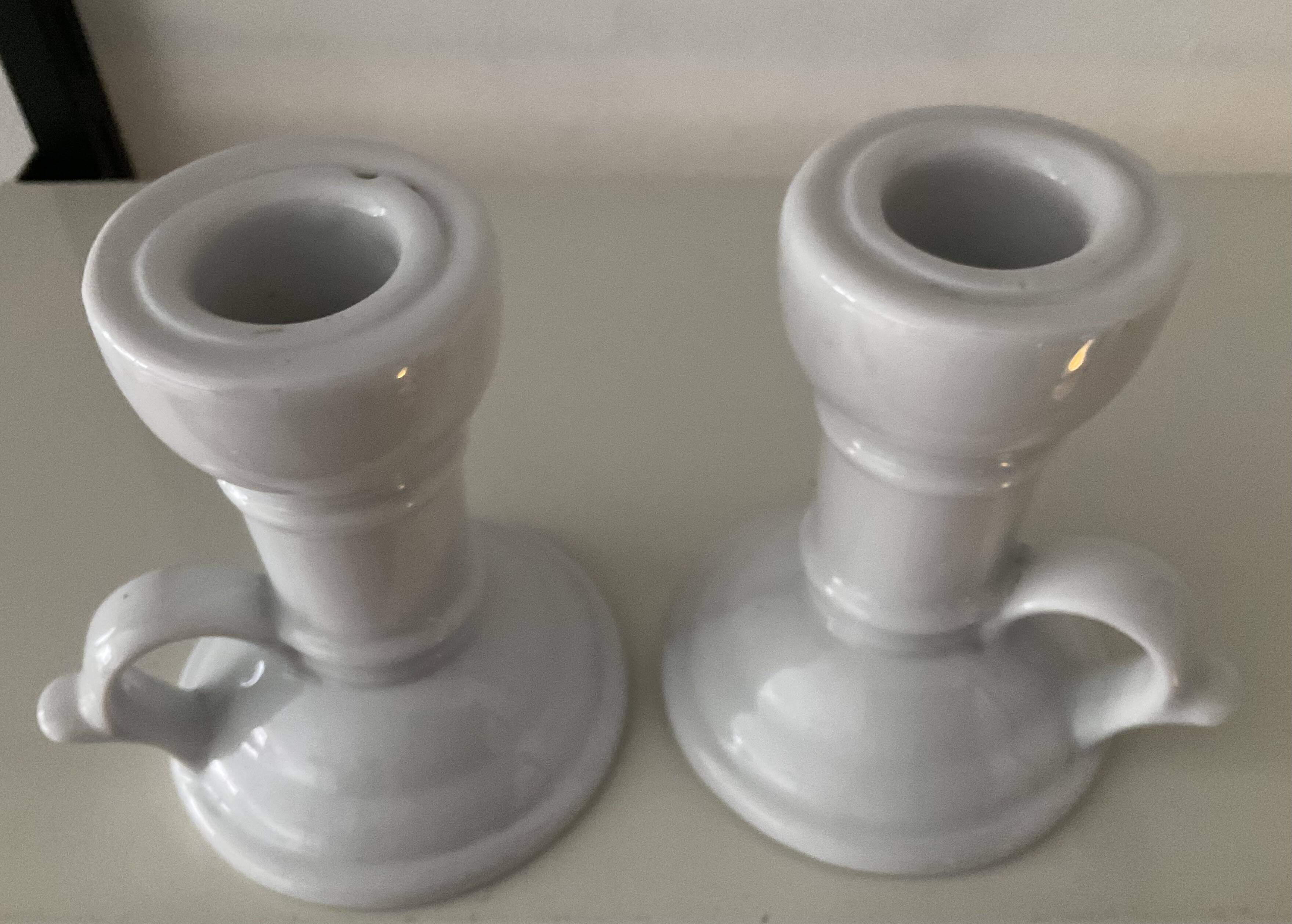 Pair of vintage cellar rat porcelain candlesticks