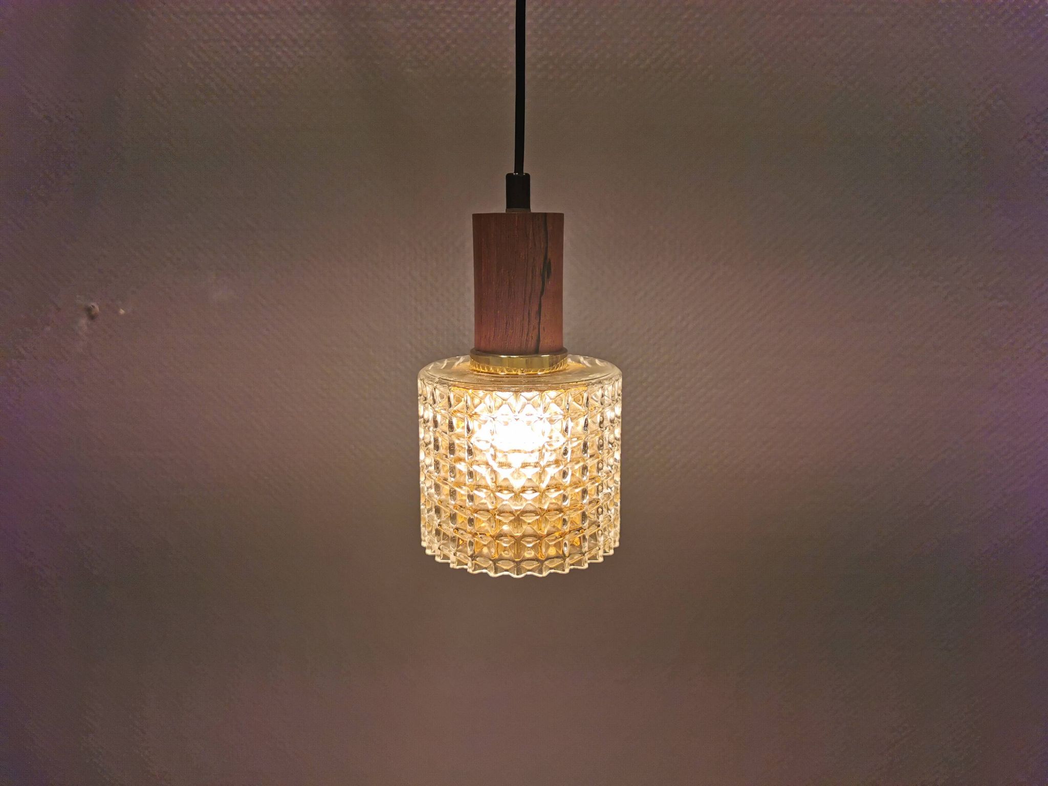 Older Swedish hanging lamp in multi-layered crystal glass with rosewood top and brass ring.