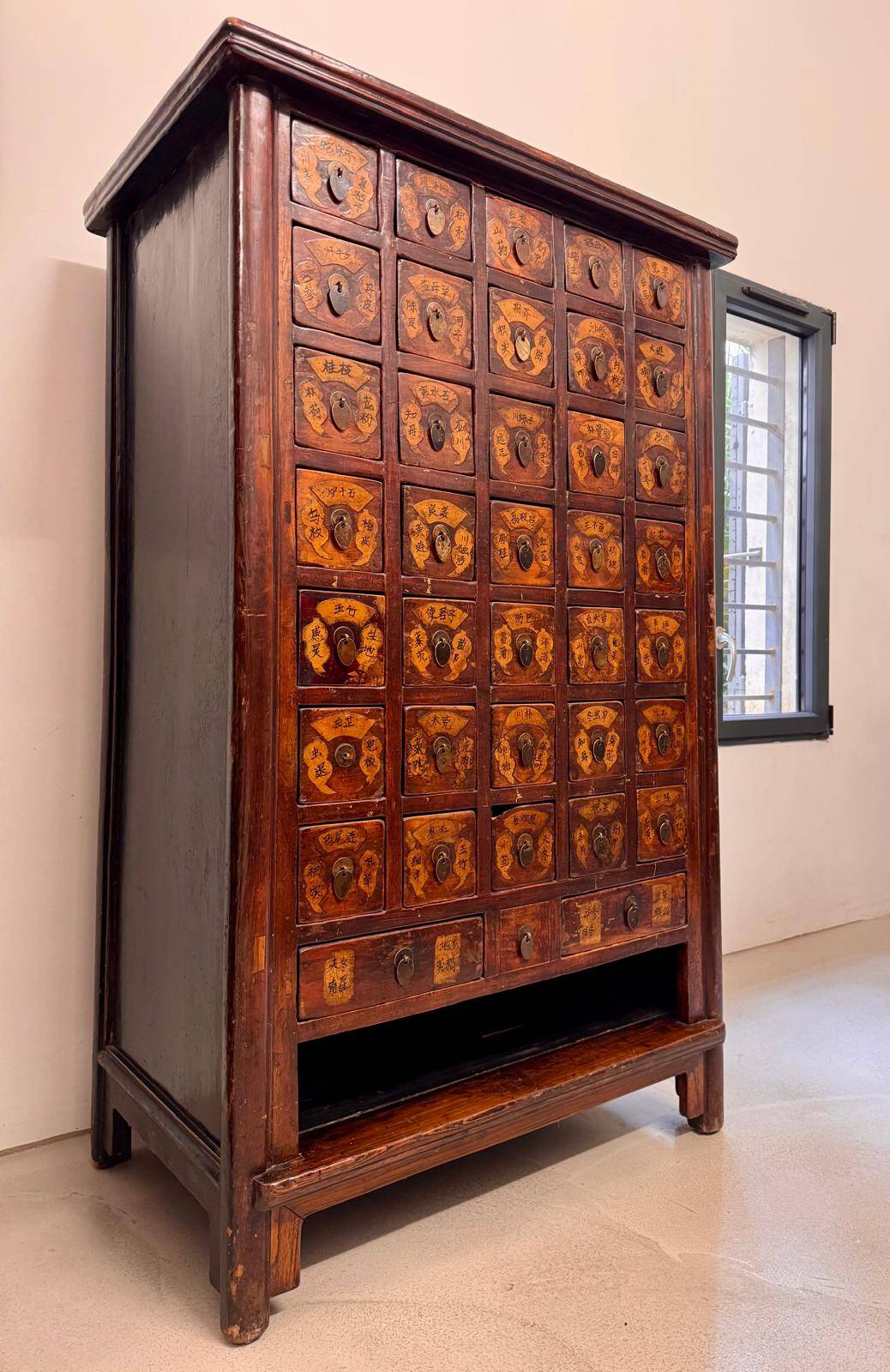 Apothecary cabinet with 38 drawers made of elm wood.