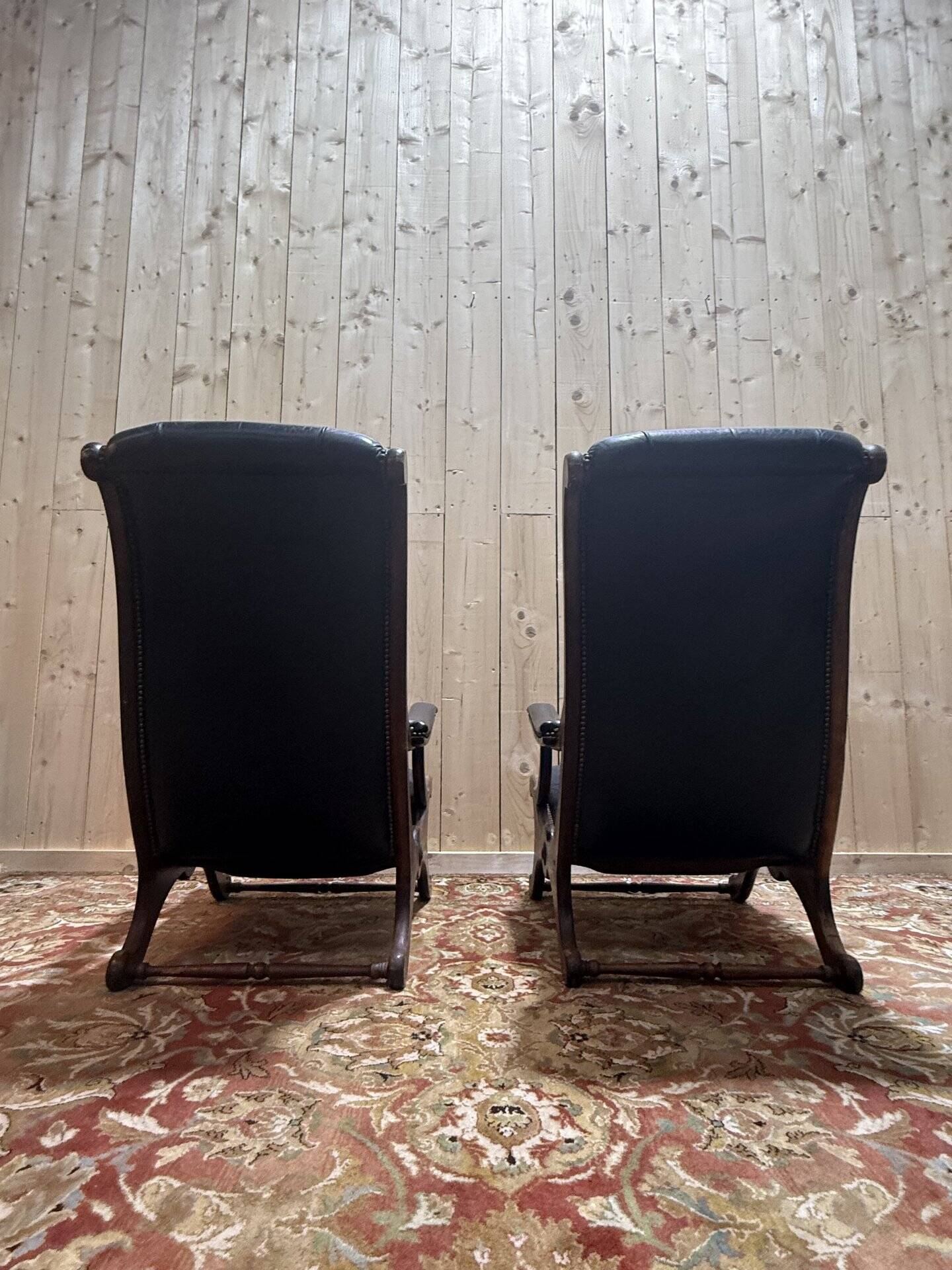 Pair of English Chesterfield armchairs in black leather