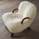 Early pair of arnold madsen clam chairs in curly sheepskin, madsen & schubell, 1944