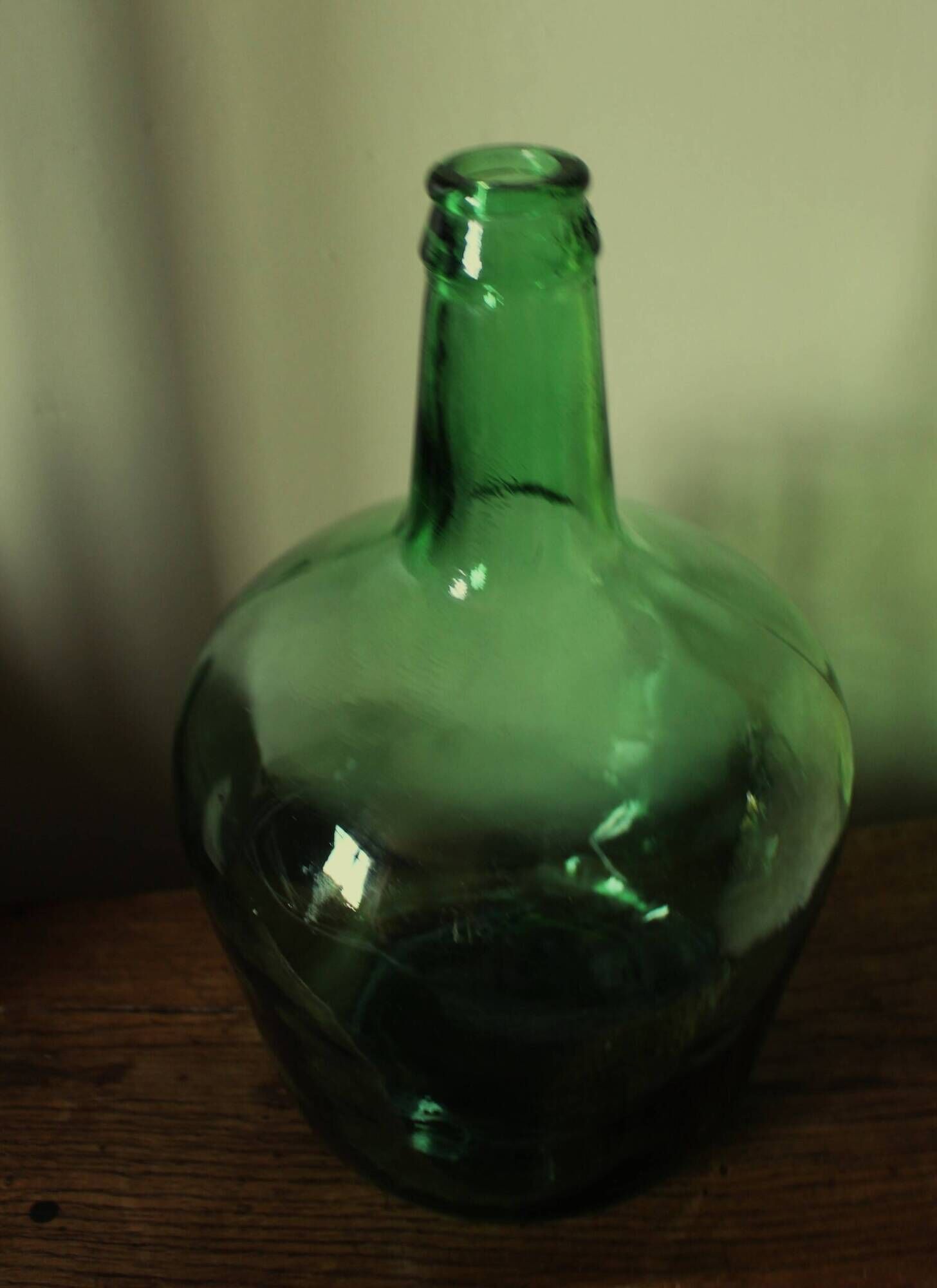 Dame Jeanne carboy from the Viresa collection in dark green glass