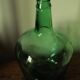 Dame Jeanne carboy from the Viresa collection in dark green glass