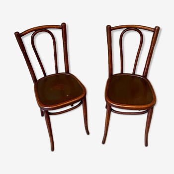 2 bistro chairs in arched and dark wood