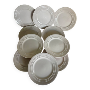 Set of 10 antique dessert plates in pale pink earthenware.