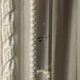 Large antique beveled mirror in carved wood painted with floral decoration and
