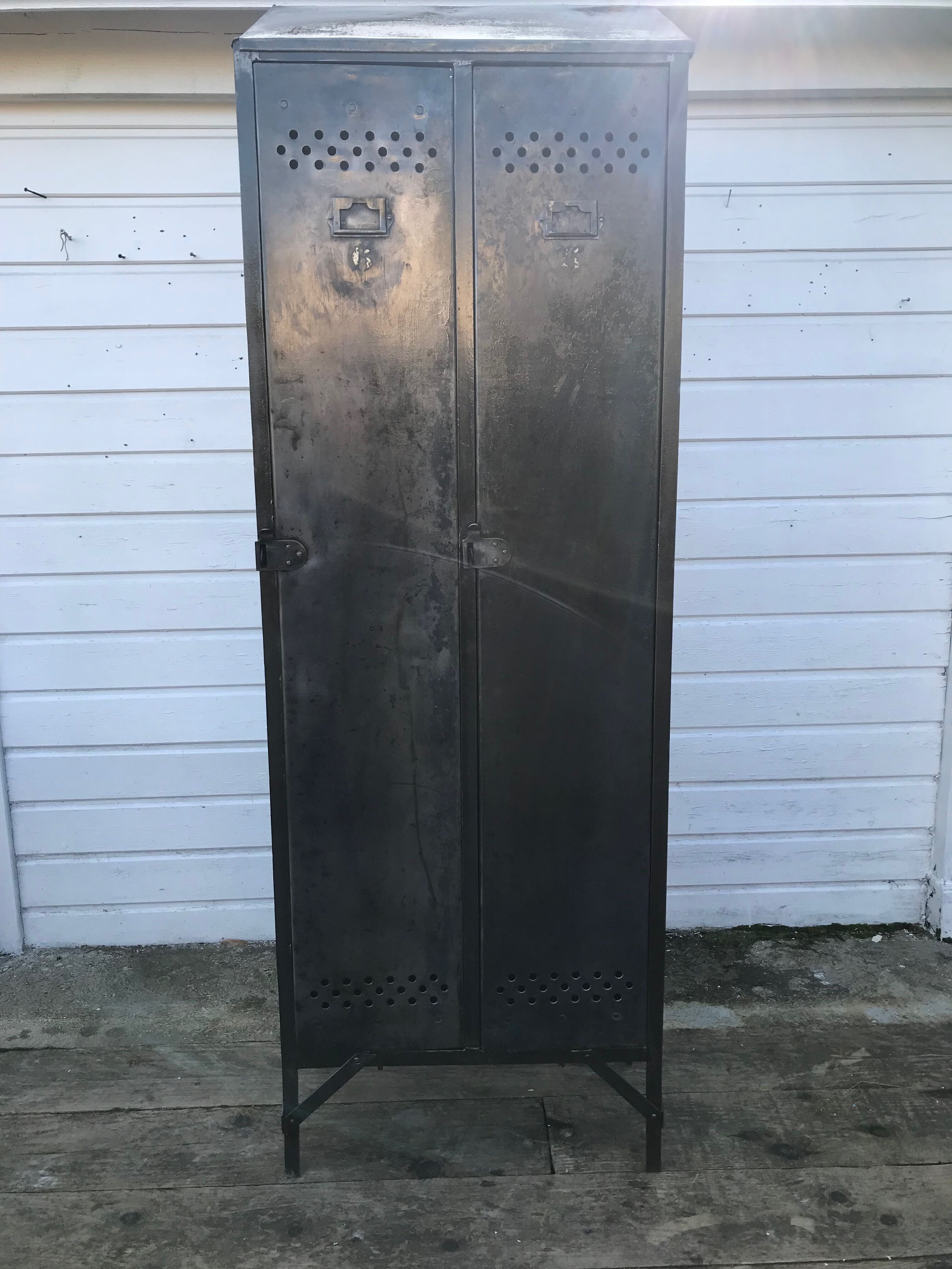 Antique riveted metal cloakroom