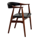 Fauteuil danois des années 1960. Bois de teck, simili cuir noir.