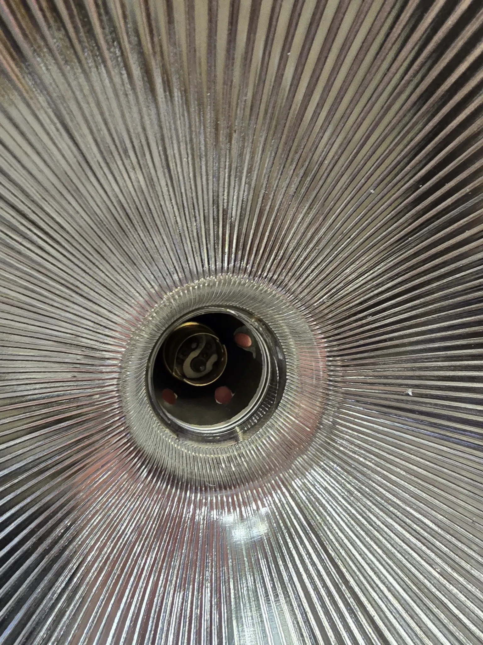 Vintage globe-style holophane on a chrome stem.