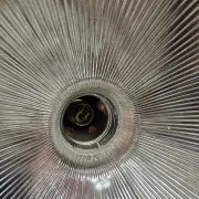 Vintage globe-style holophane on a chrome stem.