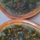 Set of 4 flamed enamel plates in green and amber from the 60s-70s.