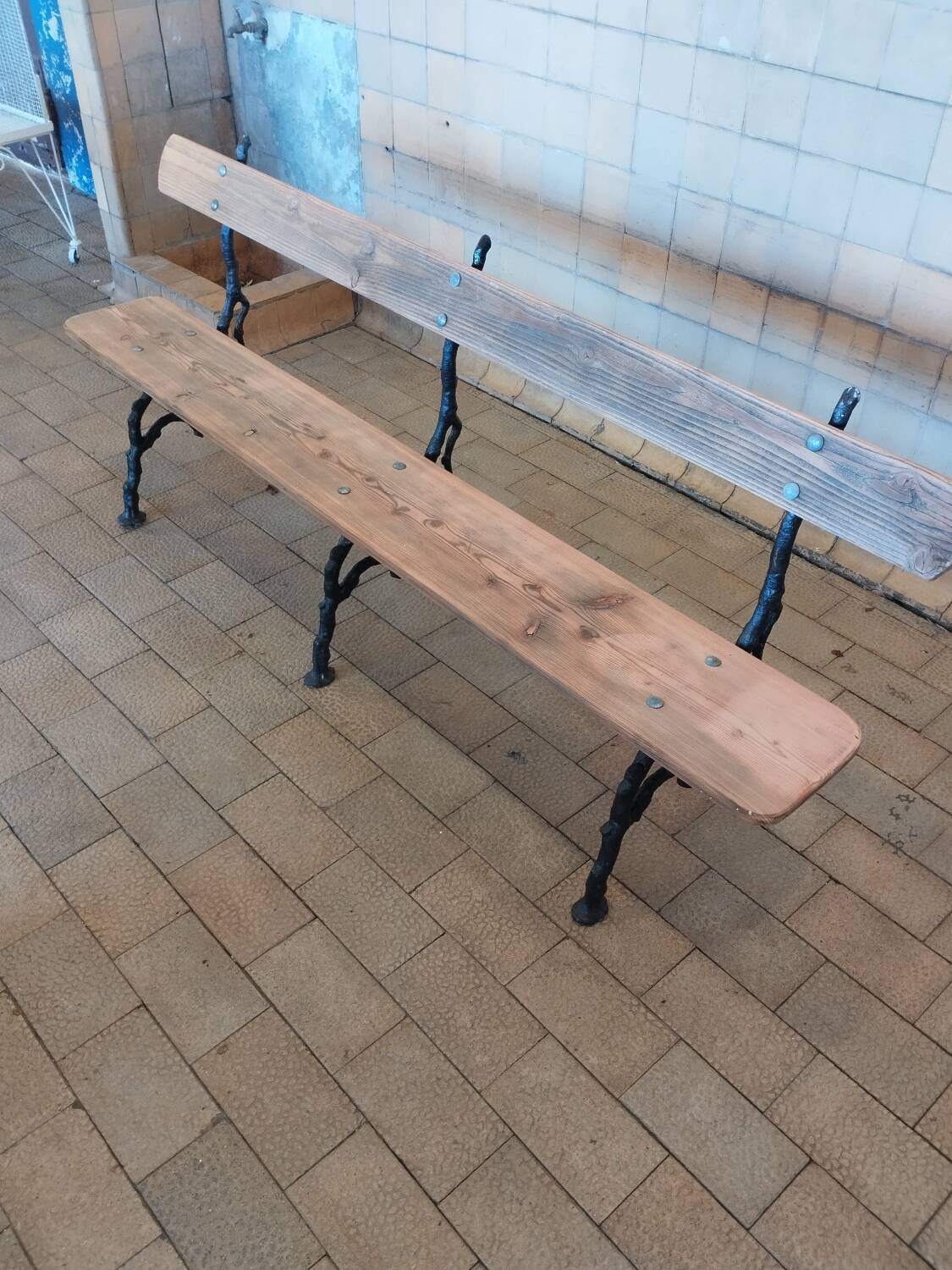 Antique garden bench with cast iron legs