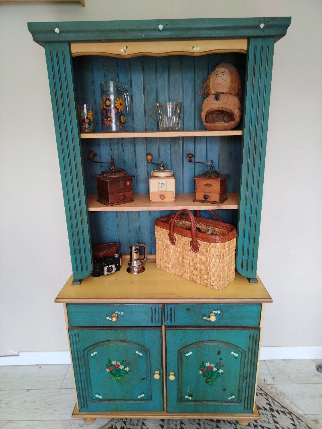 Rustic dresser with floral decor