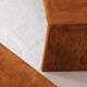 Pair of cognac suede side tables in the style of Jean Michel Frank.
