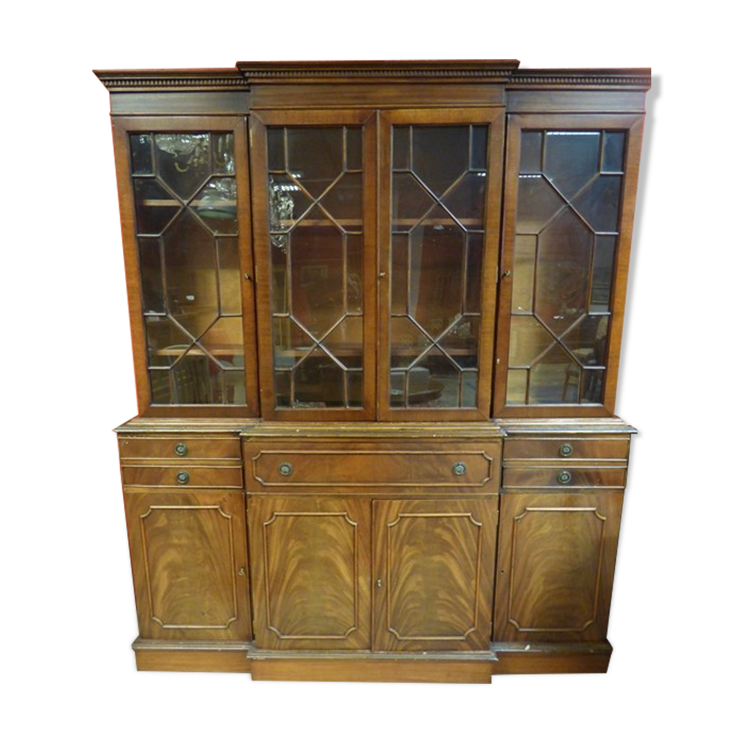 Scribanne bookcase in mahogany veneer English work of the twentieth century