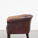 Sheep leather club chair finished with decorative nails