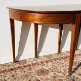 Empire-style demi-lune console from the 19th century.