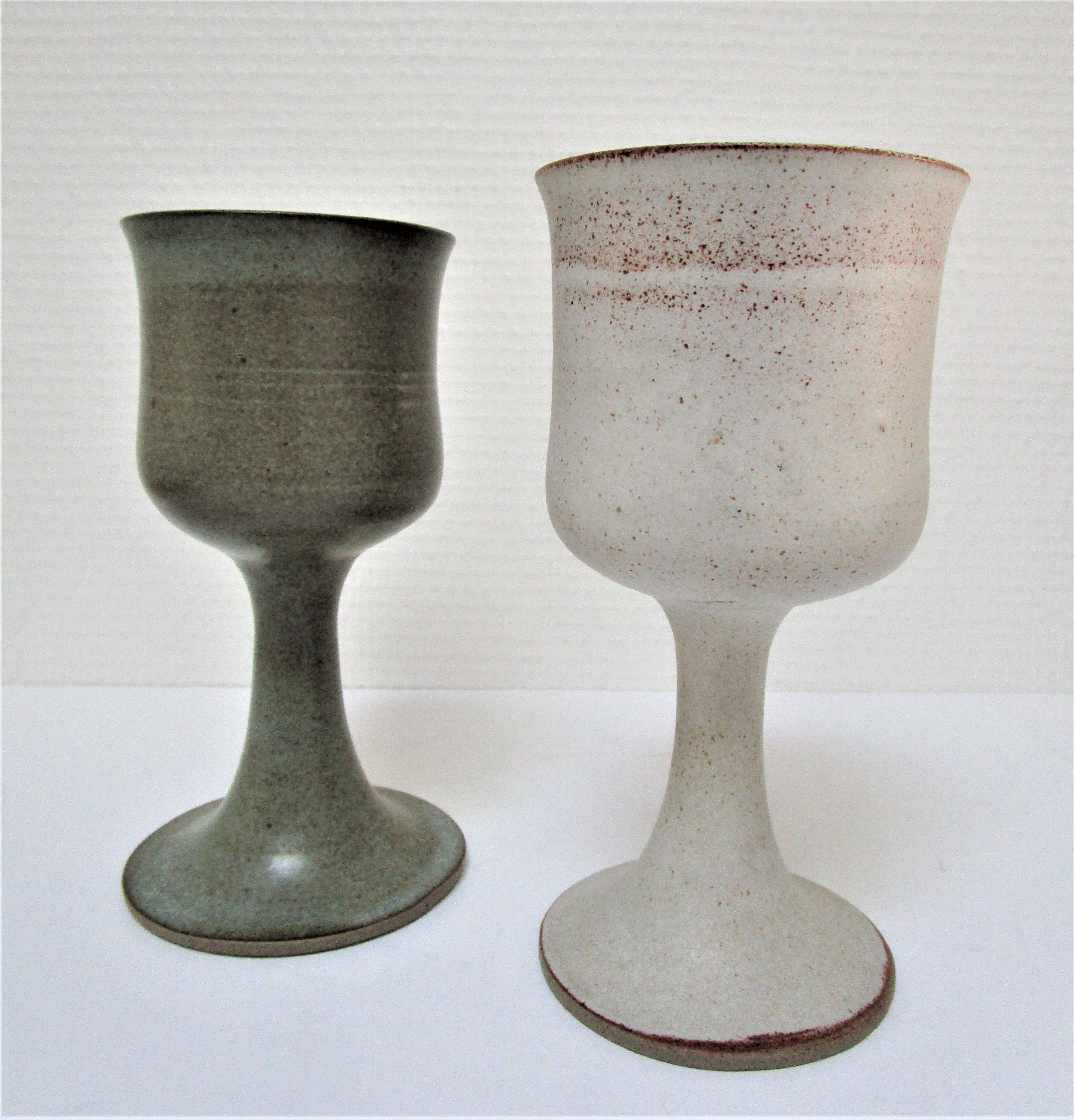 Two enamelled ceramic walking glasses