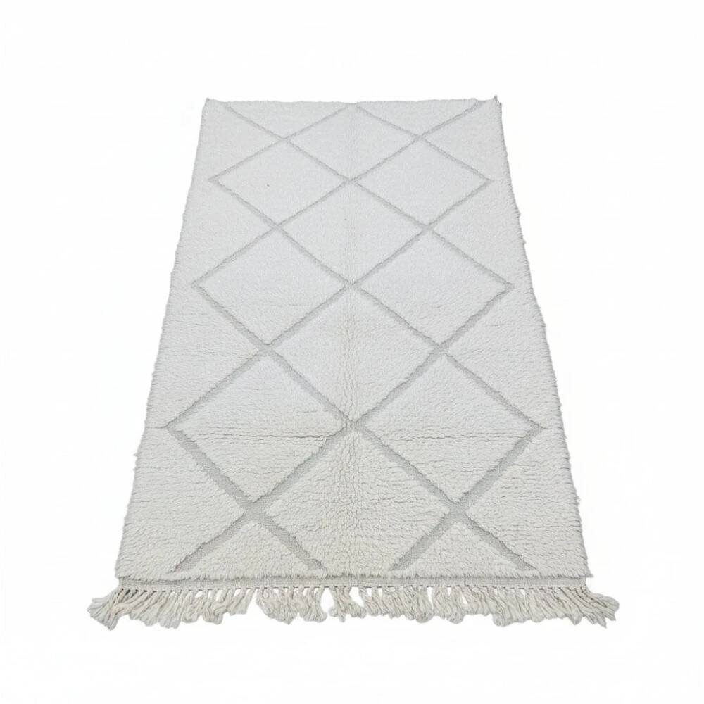 Small white Moroccan rug with diamond patterns