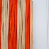 Orange and natural striped raffia wall light