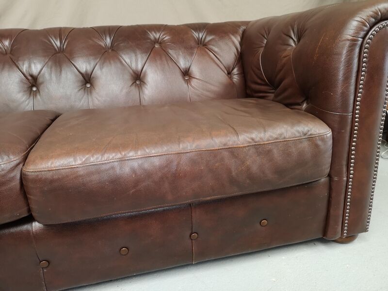 Three seater brown leather chesterfield sofa