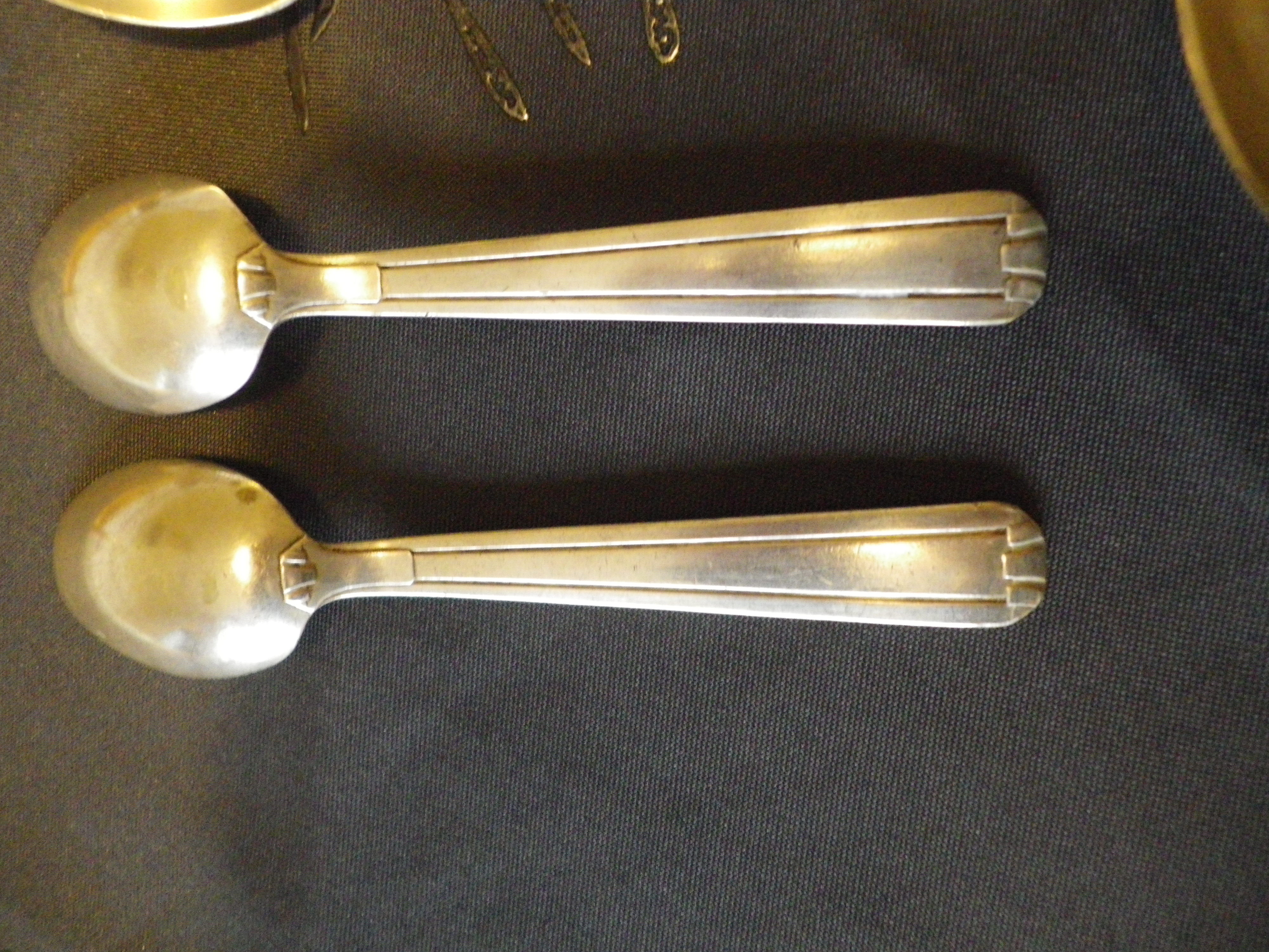 11 silver spoons with punches