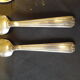11 silver spoons with punches
