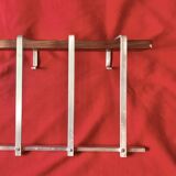 Vintage wall-mounted coat rack made of plywood and aluminum with hat rack