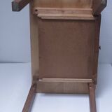 vintage wooden bedside table with crossbars and tapered legs