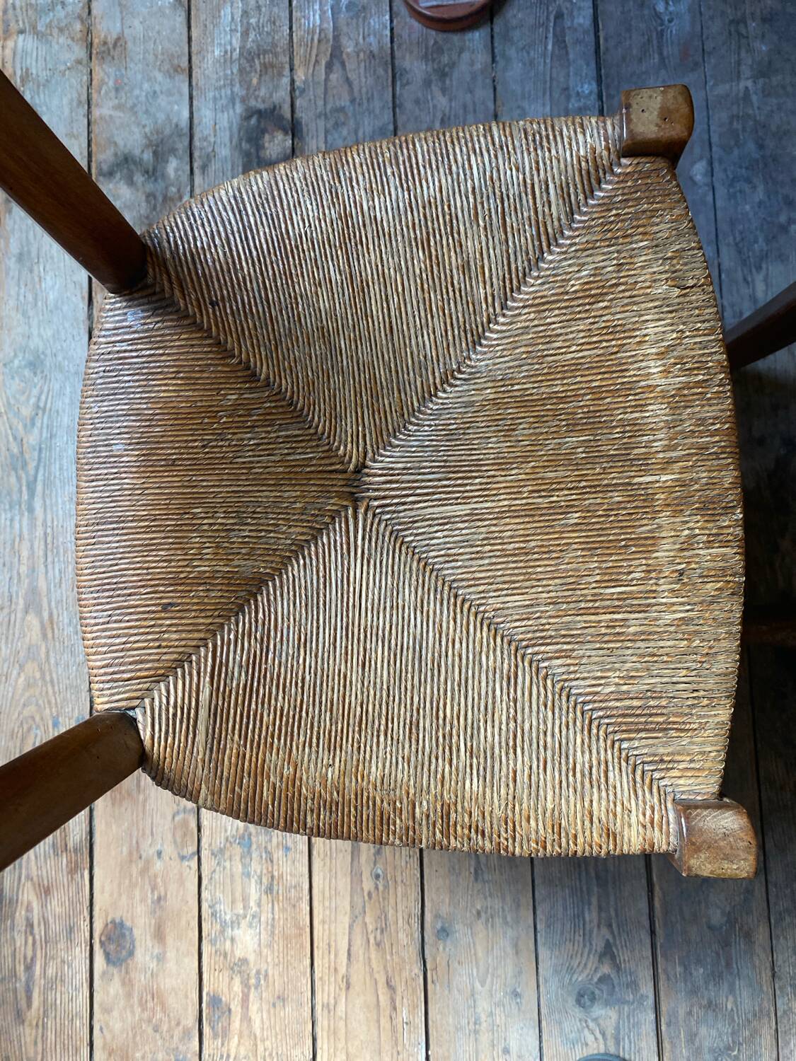 2 wooden chairs with cane