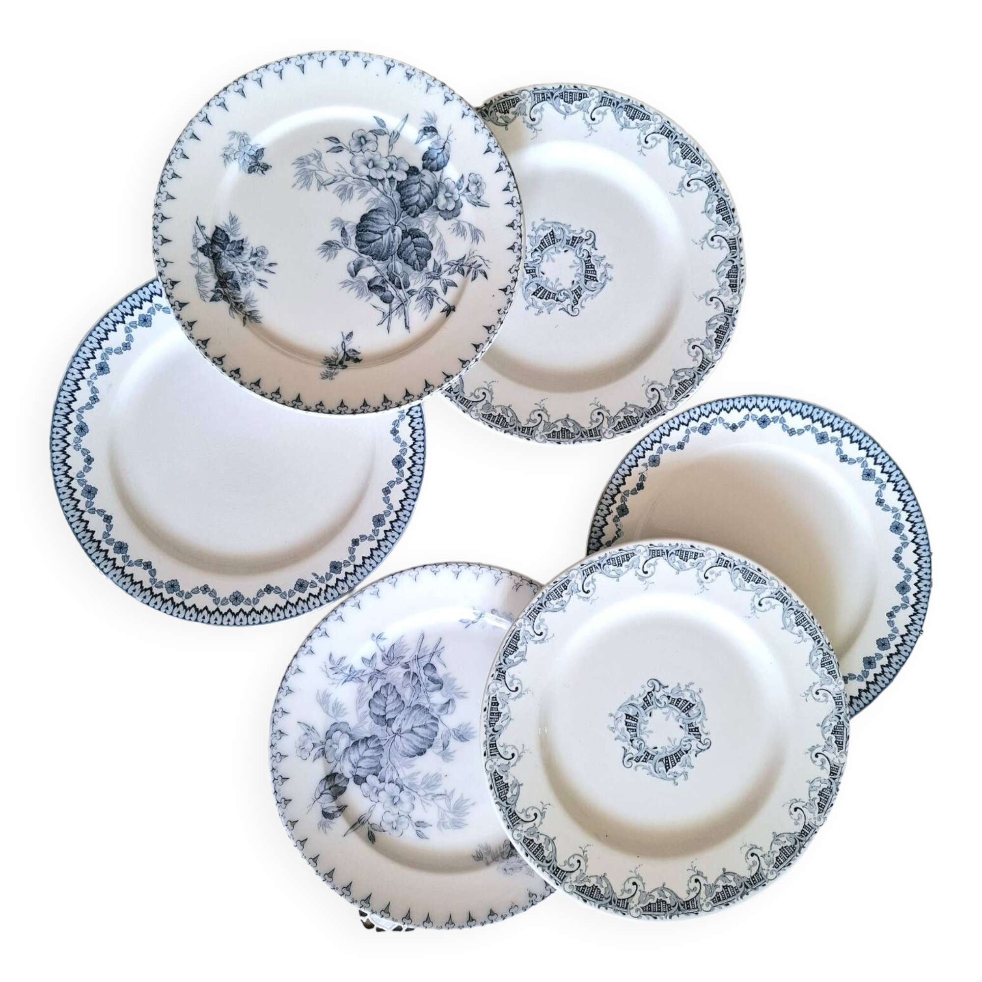 Old mismatched flat plates in iron earth earthenware