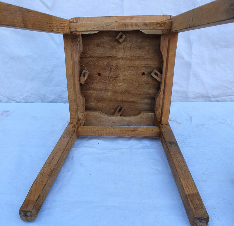 Vintage wooden stool and red skai seat
