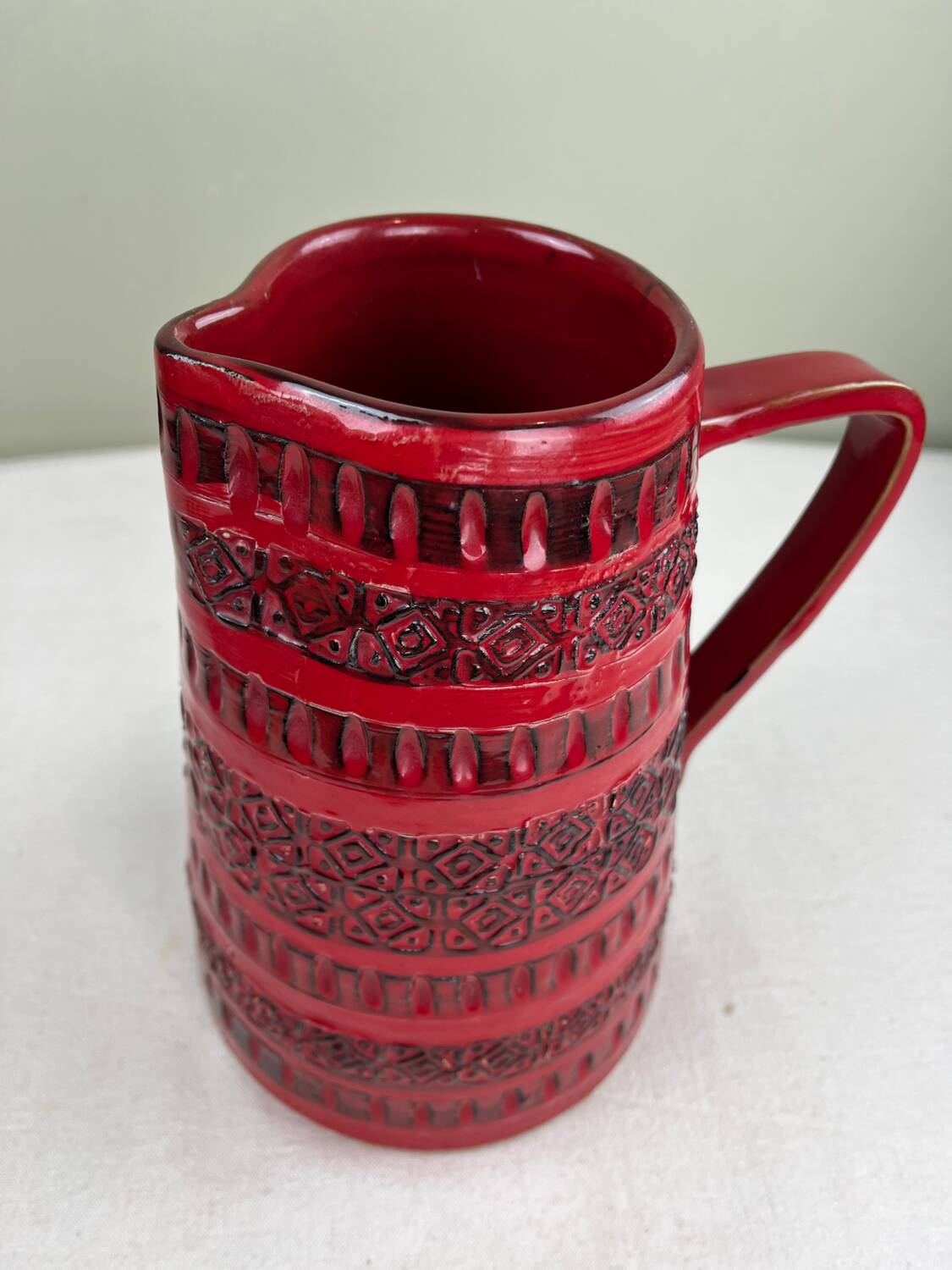 Vintage red ceramic jug