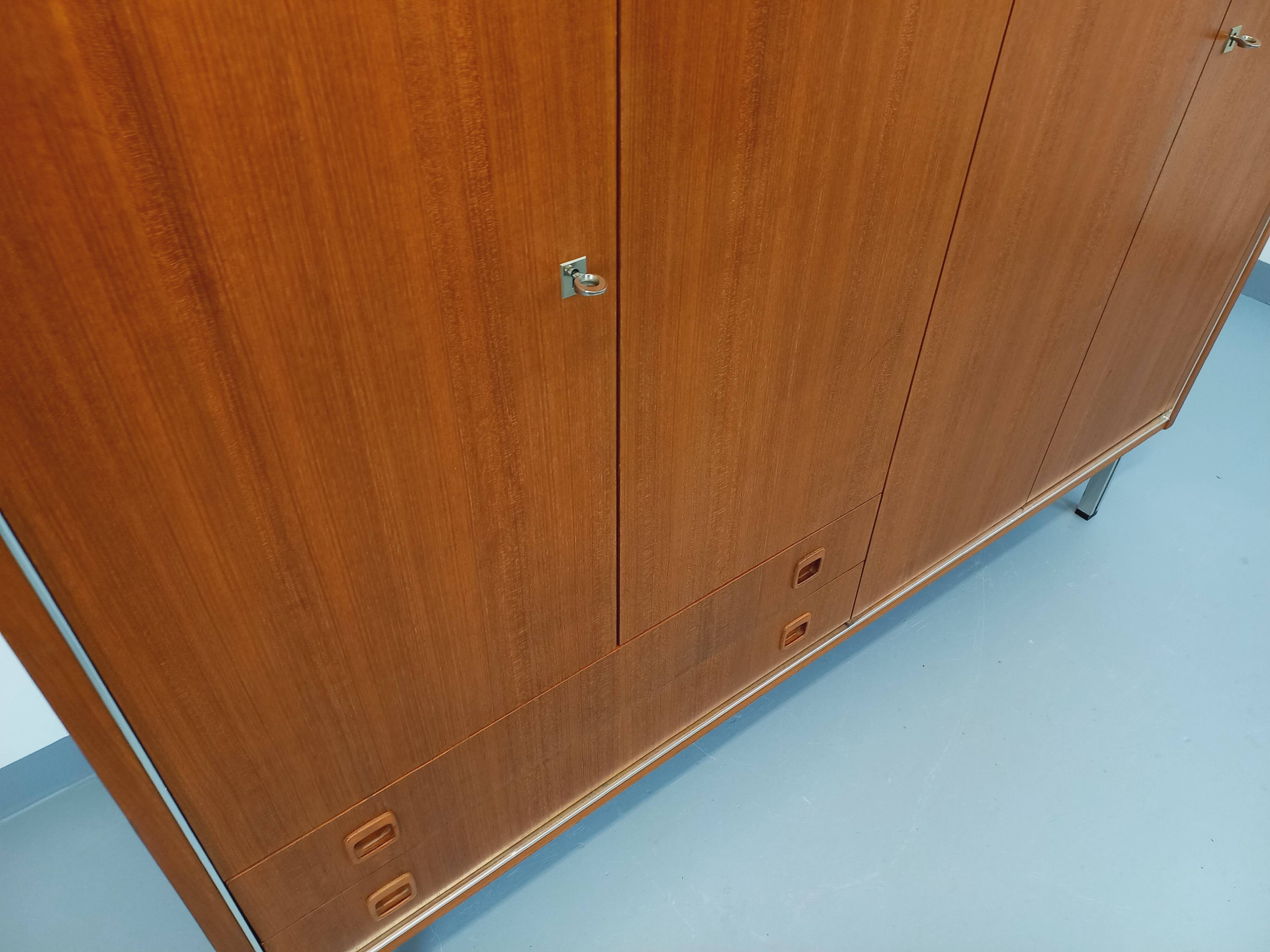 Vintage Scandinavian modernist wardrobe in teak and metal from the 1960s.