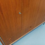 Vintage Scandinavian modernist wardrobe in teak and metal from the 1960s.