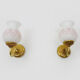 Pair of gooseneck wall sconces in gilded metal, white opaline with pink decorations