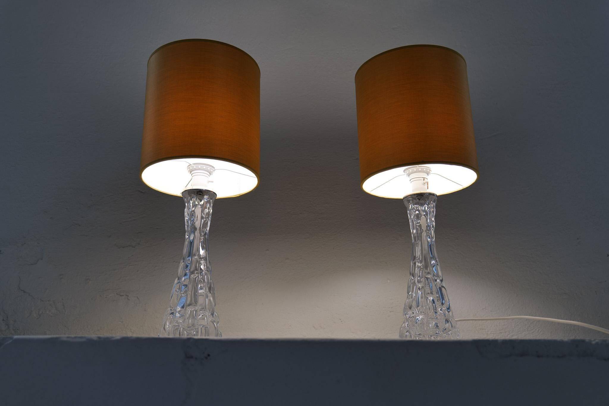 Mid-century modern crystal table lamps by Orrefors, designed by Carl Fagerlund, Sweden, 1970s.
