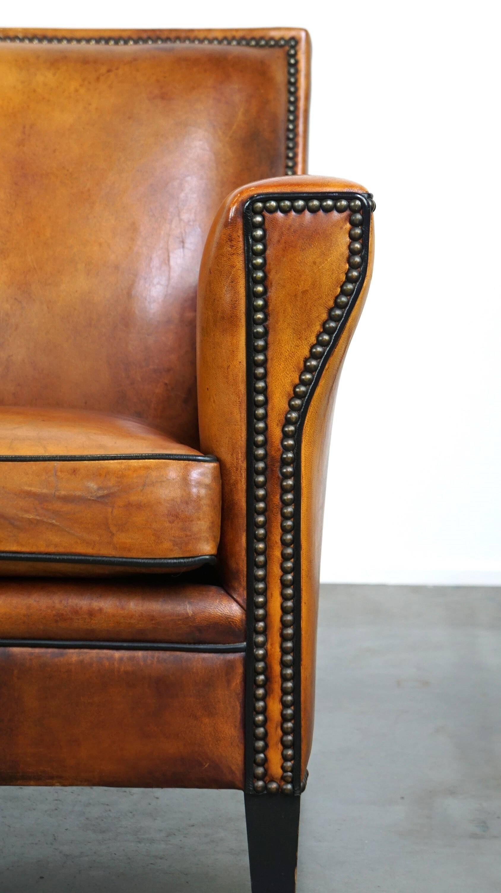 Sleek sheepskin Art Deco design armchair with beautiful details