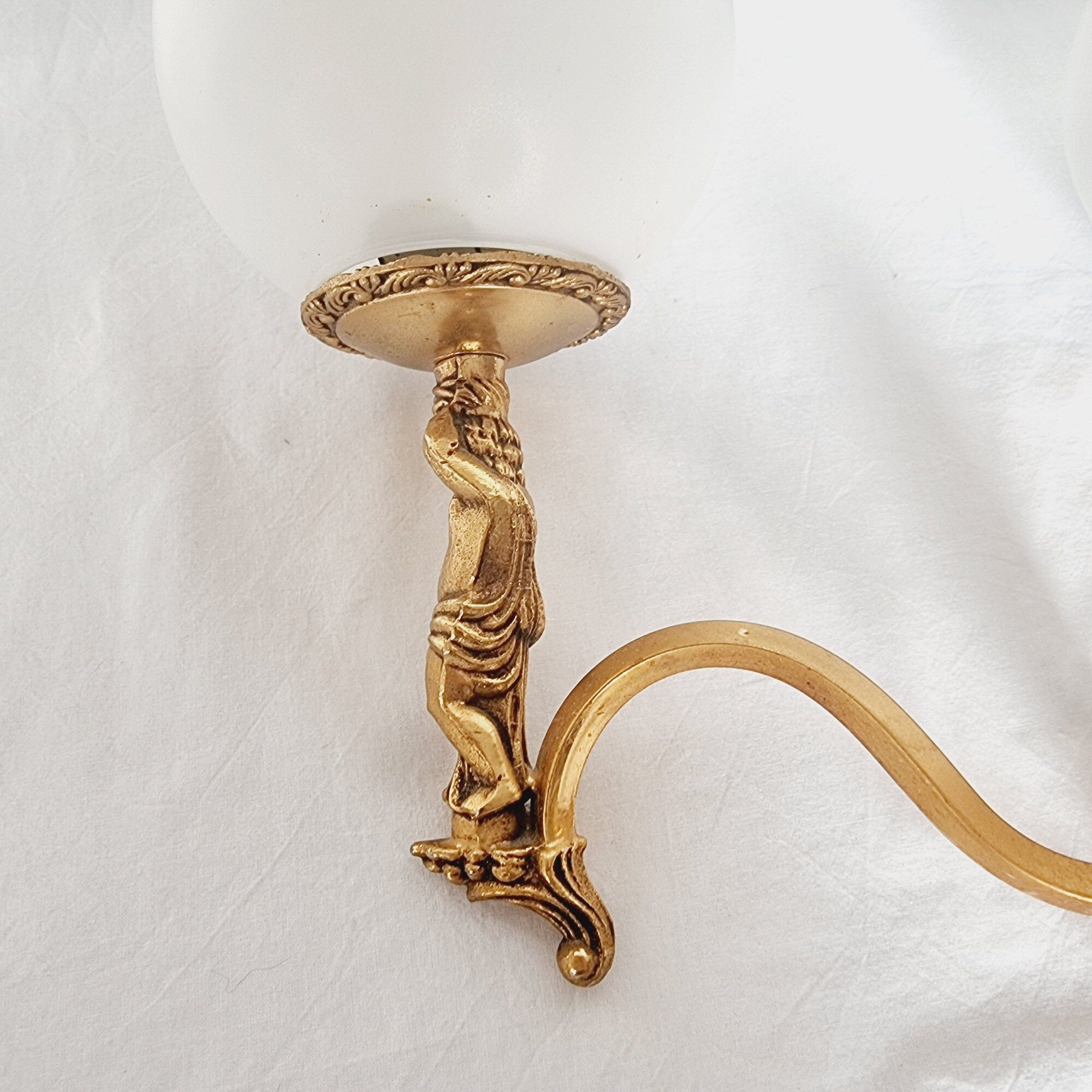 2 classic golden cherub wall lights and globe lampshades in perfect condition.