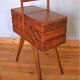 Worker sewing box feet compass