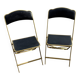 Two chairs, similar black