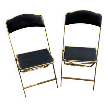 Two chairs, similar black