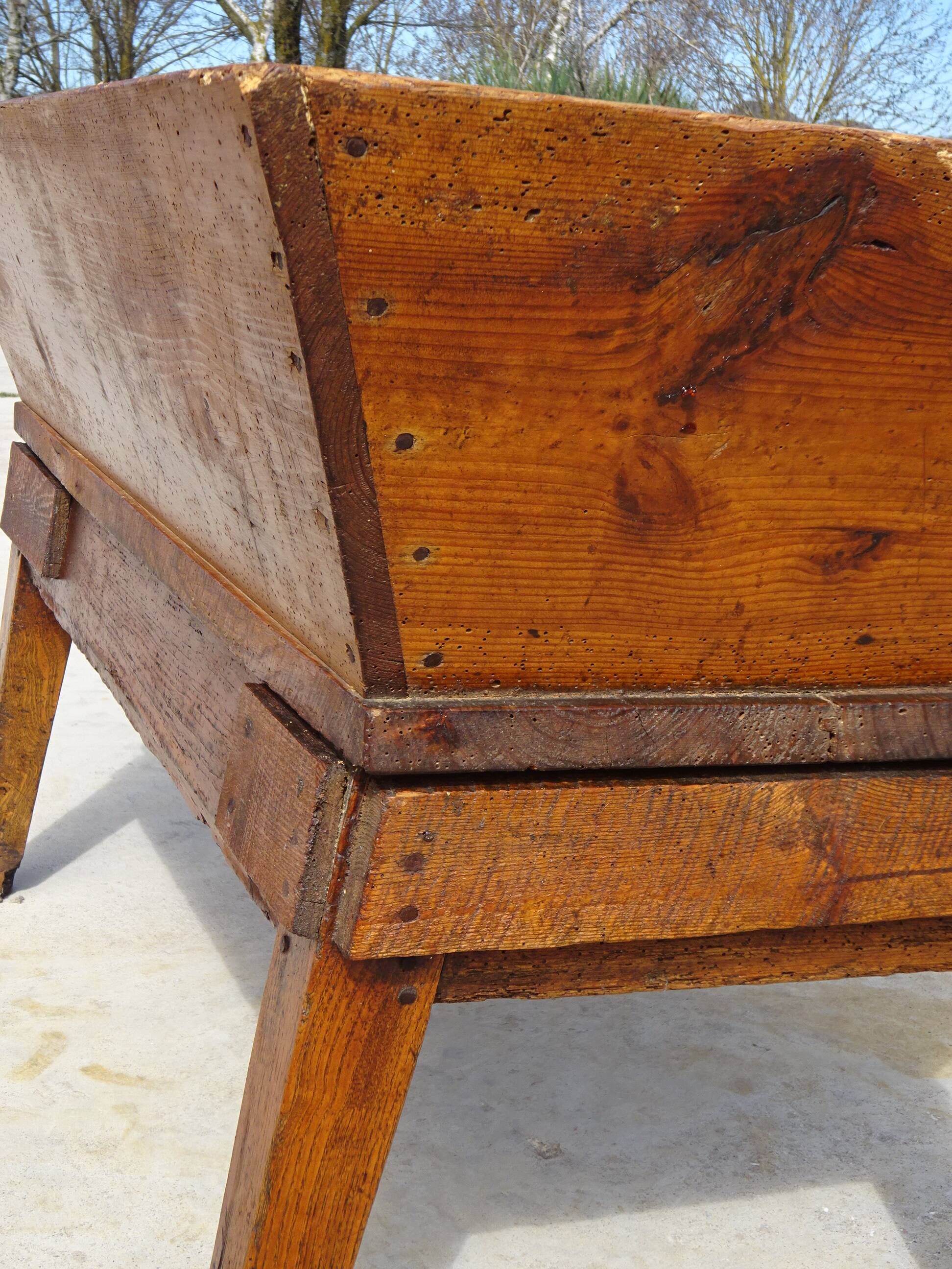 Very old solid oak dough trough with a lid and removable legs.