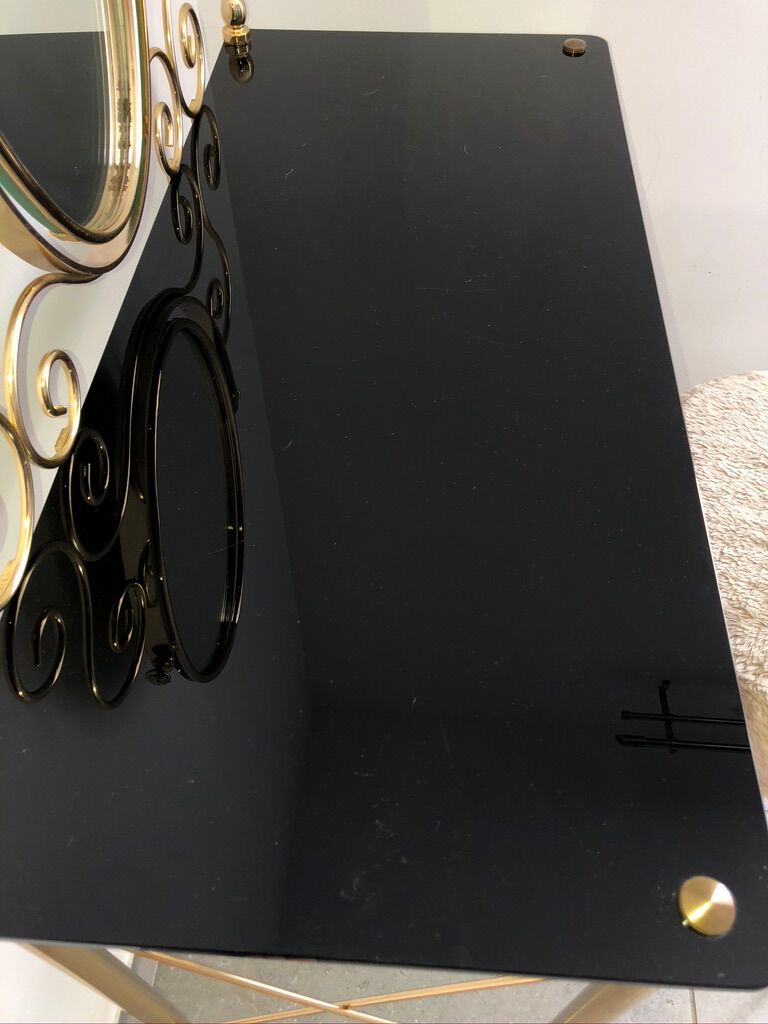 Brass hairdresser, glass and black plastic with its fluffy stool.