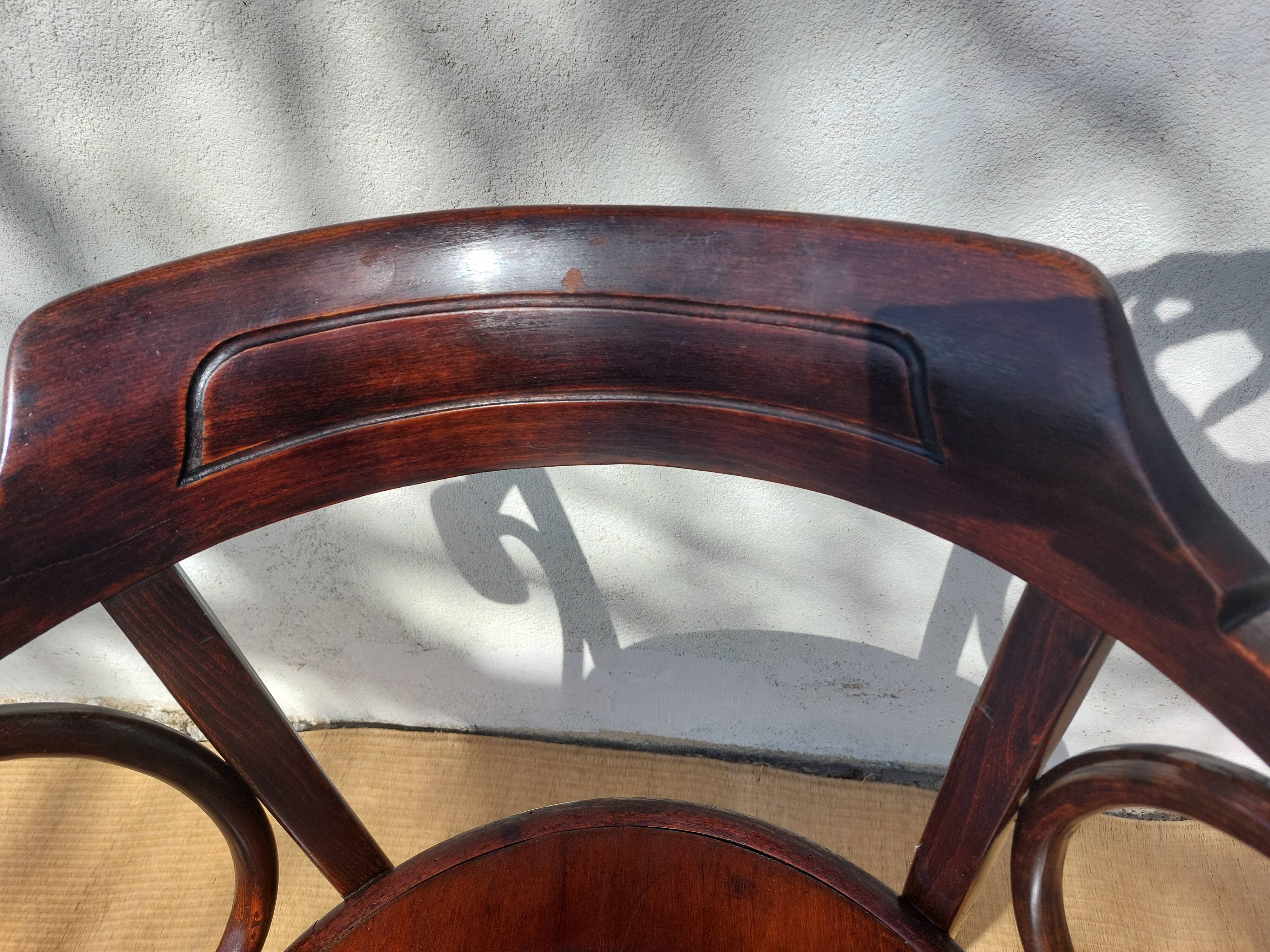 Swivel wooden armchair, pattern on seat