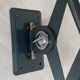 Vintage 1950s green lacquered sheet metal workshop wall light with accordion arm.