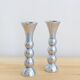 Pair of vintage cast aluminum candle holders
