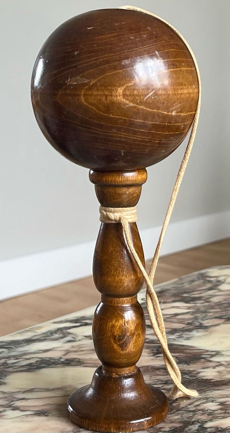 Old bilboquet in turned wood